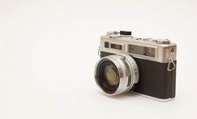 Fototapeta premium Old classic film photo camera on white background isolated with free space