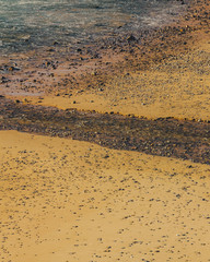 Sand with many small stones on the beach