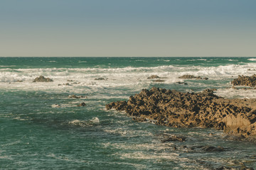 Seascape of rocks and sea on the beach