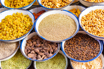 Traditional spices, dry fruits and nuts in local spicy bazaar in New Delhi, India