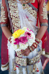 Fototapeta na wymiar South Asian Bride with bouquet