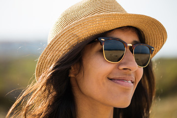 Fototapeta premium Young indian woman smiling in the countryside