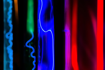 abstract background - glow of inert gases in plasma tubes