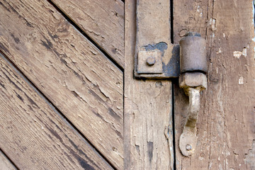 Old loop on the gate of the barn close-up.
