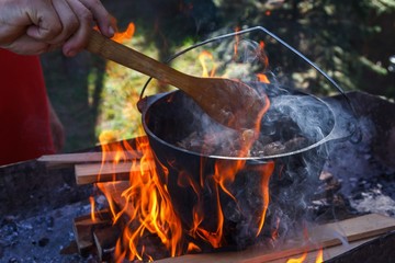 Bowler cooking food bonfire cauldron,  cook.
