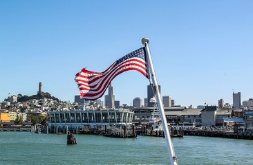 Beautiful view of San Francisco landscape with american flag on front line . Beautiful backgrounds.