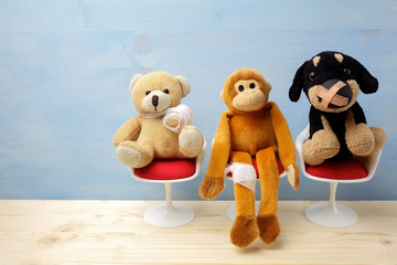 Pediatrician. Toy animals sitting on the chair in hospital. Health center for children.