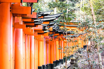Orange gates and objects at Fushimi Inari-Taisha Shrine in Kyoto, Japan