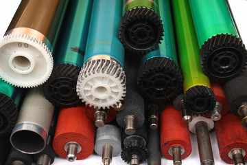 Parts of old laser printers. Photosensitive drums, rubber and metal shafts and rollers.