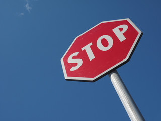 stop sign over blue sky