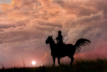 Wild horse and girl like film, silhouette on colorful storm clouds 