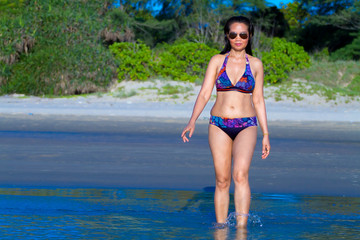 Woman and bikini pretty with sunshine on beach