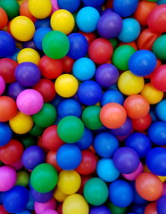 Fototapeta na wymiar Background of colored balls for dry pool close up.