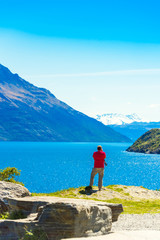 Fototapeta premium Stones on the background of a mountain landscape in Southern Alps, New Zealand. Vertical. With selective focus.