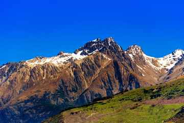 Mountain landscape of the Southern Alps, New Zealand. Isolated on blue background.