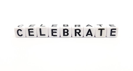 celebrate word built with white cubes and black letters on white background