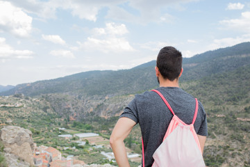 young man looking away in the mountain