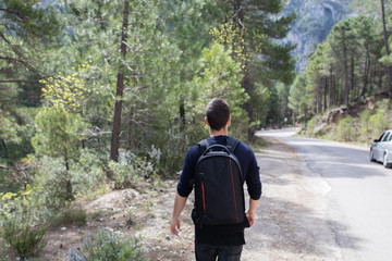 Young man walking in the mountain