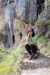 Young Iindian woman sitting in the mountain