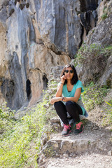 Young indian woman sitting in the mountain