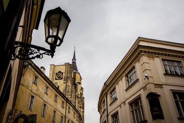 Old street lamp and historic church facade at dusk © joangasconcomas