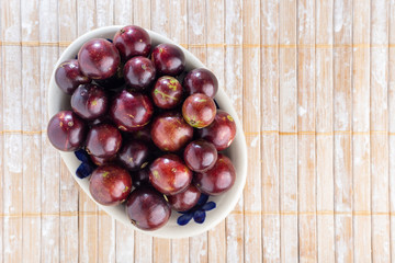 fruits of jaboticaba in bowl on the table
