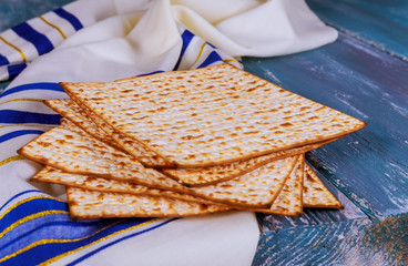 Passover matzoh jewish holiday bread over table.