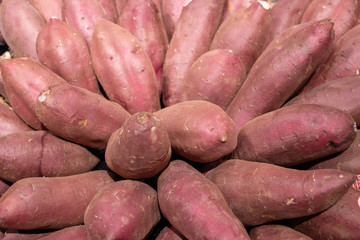 Sweet potatoes piled in market