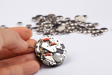Watchmaker replaces battery in quartz wristwatch