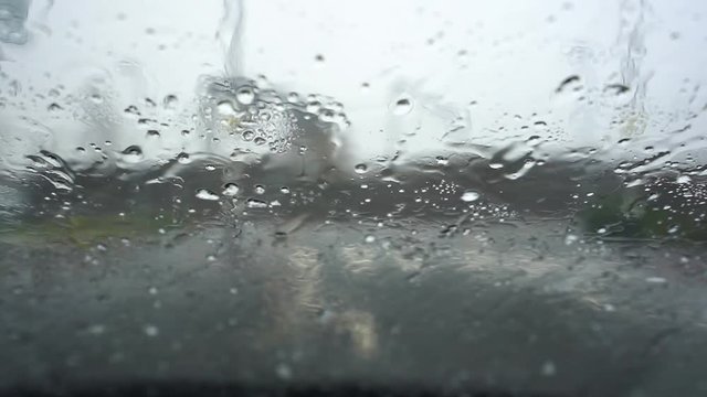 Heavy rain, hale, hail on the windscreen making visibility poor and driving conditions dangerous and un predictable