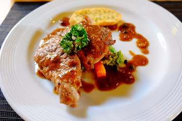 Close-up Black-peper chichen steak dish.