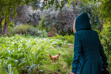 Woman Enjoy the beautiful nature of demnate marrakech and chicken running