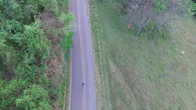 Aerial image of freeway hill with skater walking