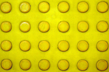 Texture of the yellow rubber.