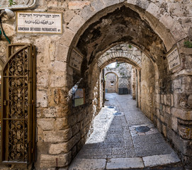 Ancient narrow street  in old city of Jerusalem that  is considered holy to the three major...