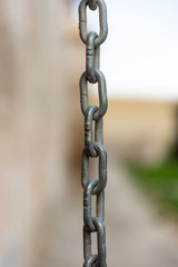 Metal chain on blurry background