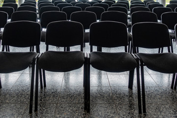empty chairs in the foyer of a hall