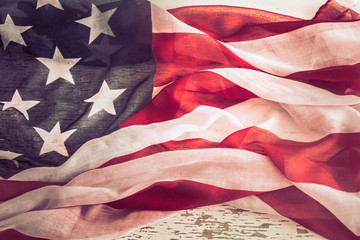 Patriotic symbolism. American flag on wooden background