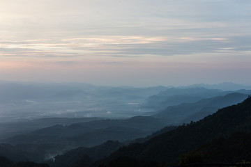 Fototapeta na wymiar Beautiful mountain and morning sunrise over the sea of mist. Mon Sone View point , Doi Pha Hom Pok National Park in Chiang Mai,Thailand.