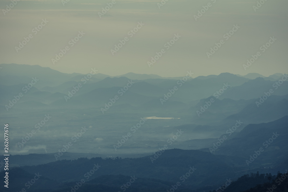 Wall mural beautiful mountain and morning sunrise over the sea of mist. mon sone view point , doi pha hom pok n