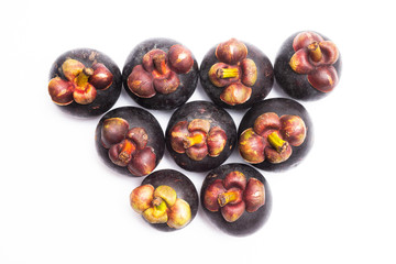 Group of mangosteen isolated on white background. Mangosteen is a queen of fruit in Thailand and asia fruit have a sweet. Fresh dark mangosteen background. Mangosteen is a popular fruit in Thailand.