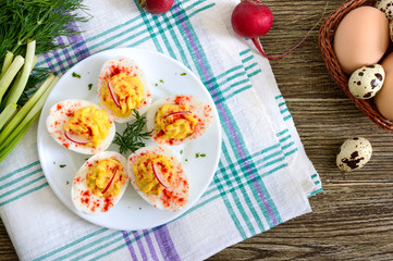 Deviled eggs. Delicious appetizer. Boiled eggs stuffed with yolk, mustard, mayonnaise, paprika. Classic recipe. The top view