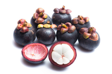 Mangosteen whole and half cut isolated on white background. Mangosteen is a queen of fruit in Thailand and asia fruit have a sweet. Mangosteen background. Mangosteen is a popular fruit in Thailand.