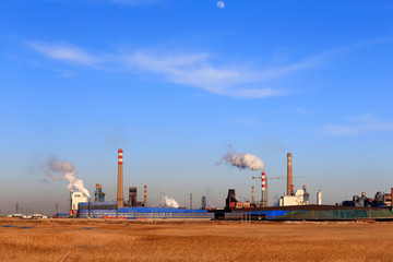 A chemical plant against a blue sky