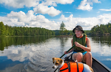 Woman paddling with canoe