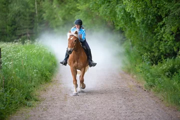 Foto op Canvas Woman horseback riding © citikka