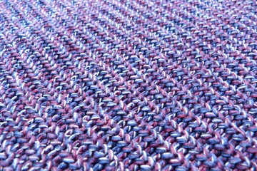 Fototapeta na wymiar purple melange knitted fabric closeup knitwear background