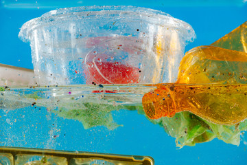 Transparent food container floating on the water surface