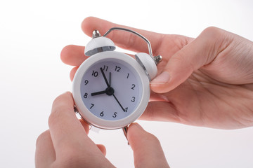 Alarm clock in hand