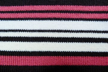 striped knitted knitted closeup background black red white